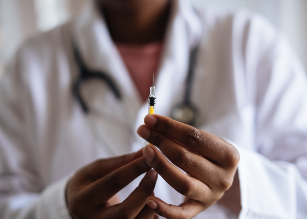 Doctor holding up a Vaccination needle