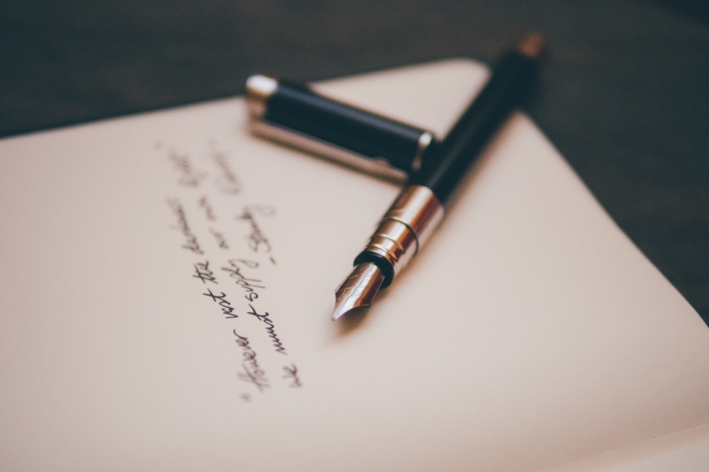 Quill on paper