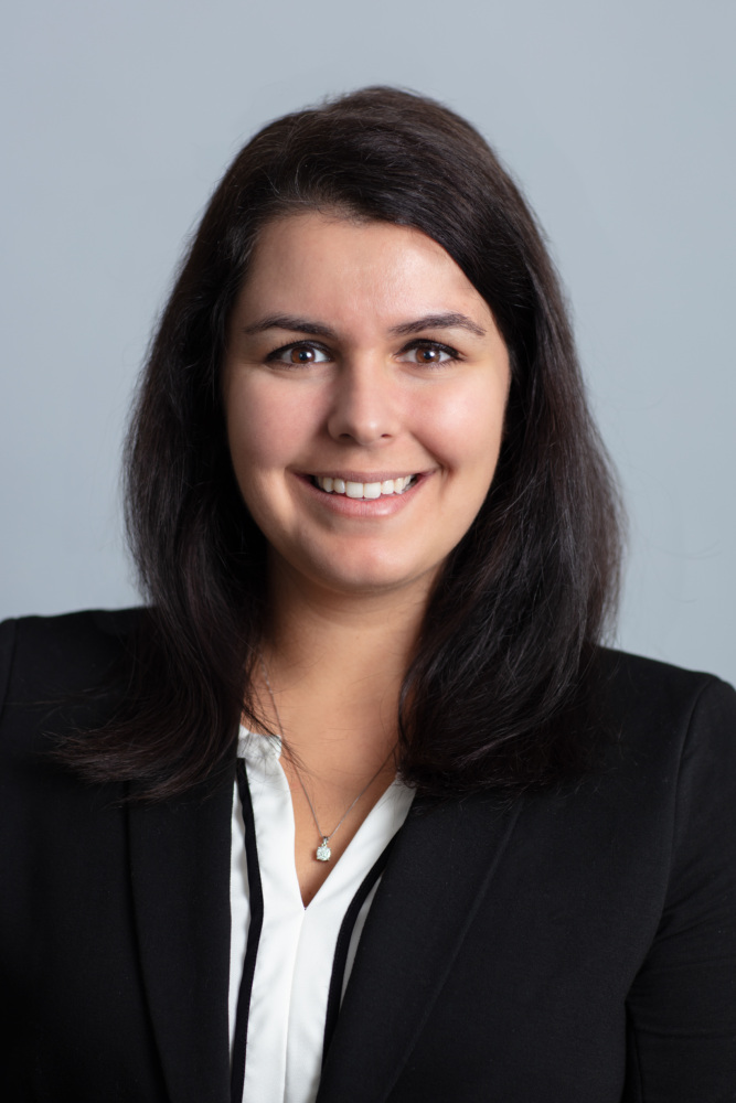 Headshot of Liz Field wearing a black suit jacket.