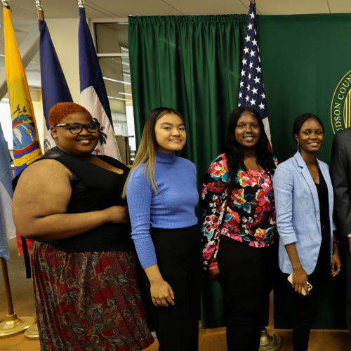 Hudson County Community College students standing to receive their diplomas.