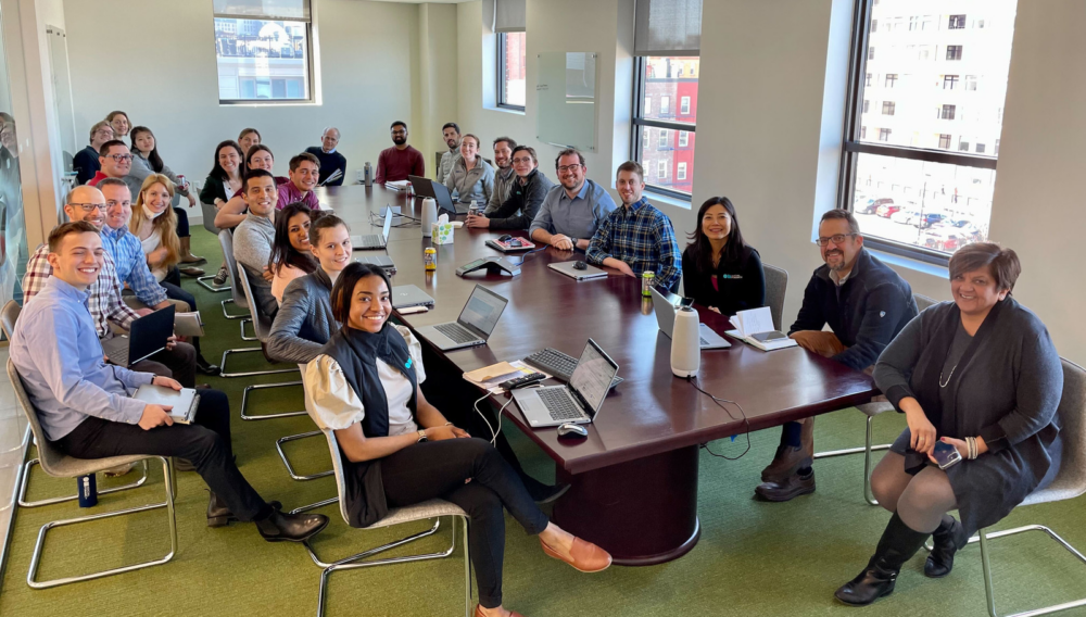 Social Finance staff gathered in a meeting room.