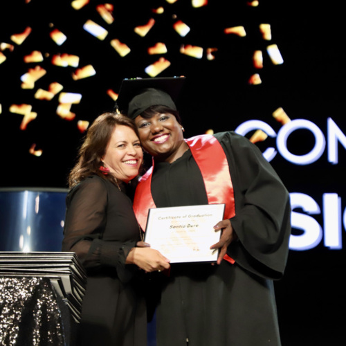 A student celebrates graduation from CrossPurpose, a training provider in the Colorado Pay It Forward Fund.