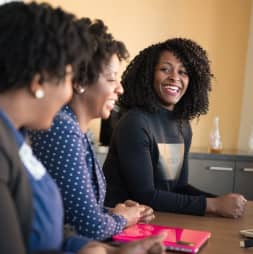 A group of women sitting at a table.