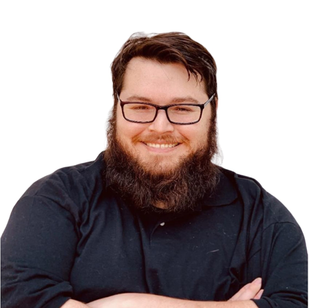 Man with glasses and a full beard, wearing a black collared shirt, smiling with arms crossed against a white background.