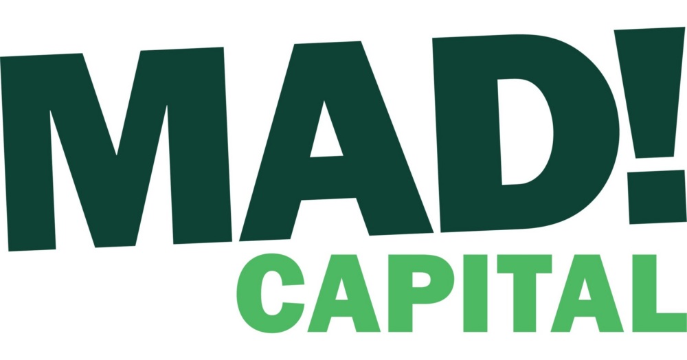 The image features the words "MAD! CAPITAL" in bold, uppercase letters; "MAD!" is dark green and "CAPITAL" is light green.
