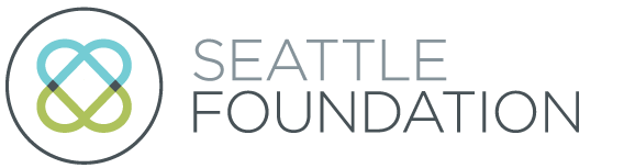 Seattle Foundation logo with overlapping blue and green loops inside a circle, next to the words "Seattle Foundation" in gray text on a light background.